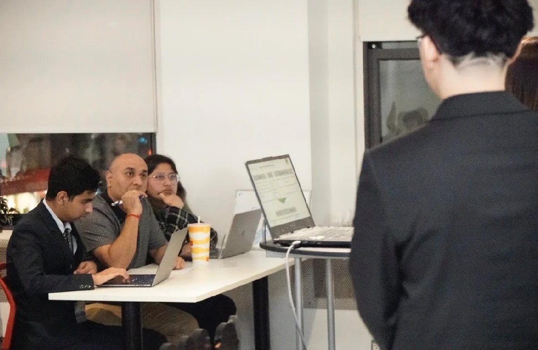 A student presenting a recommendation to judges